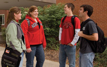 four students talking